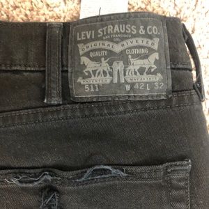 Black ripped Levi jeans 511
